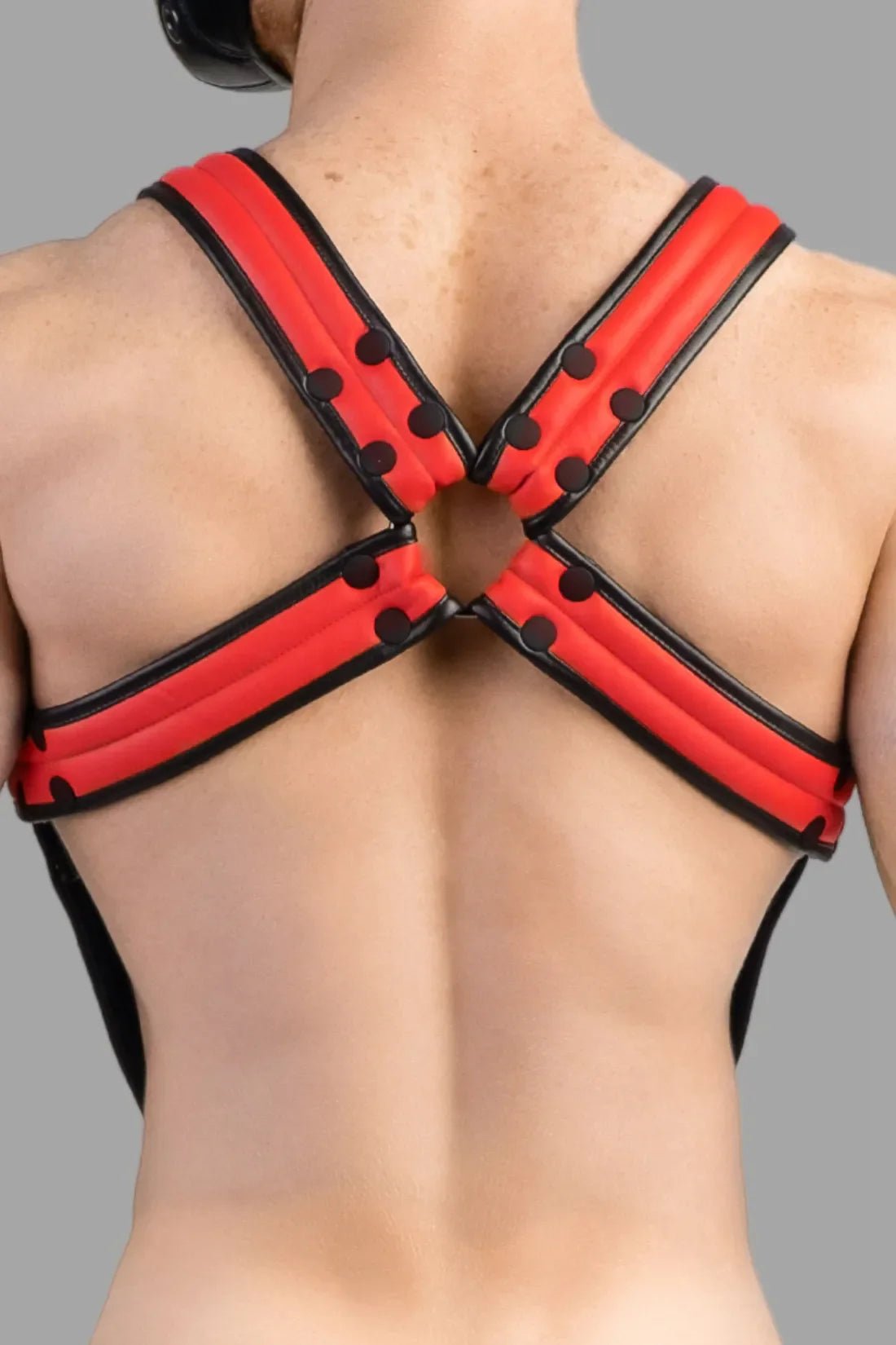 Maskulo Armored Next Body Harness in black and red, featuring durable polyester/polyurethane blend and removable cockring.