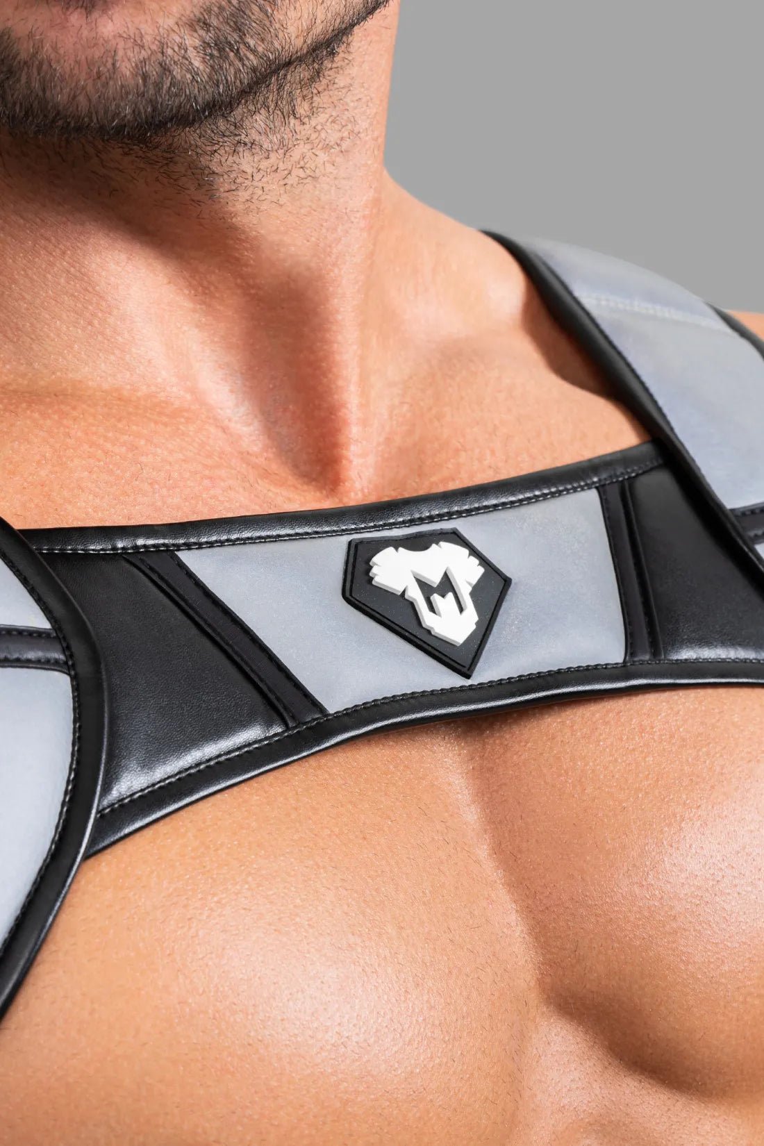 Maskulo Black & Grey Reflective Light Body Harness. Push-up effect, adjustable size, PU leather piping, and UV-glowing elements.