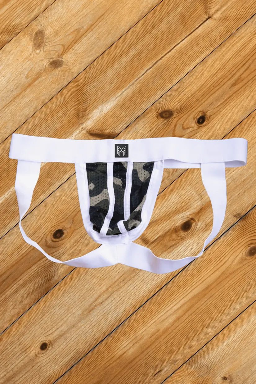 Maskulo Kyle Steelguard Mesh Jockstrap in Camouflage and White. Soft, silky, breathable mesh with a silicone "cuirass" symbol. Polyester/Elastane blend.