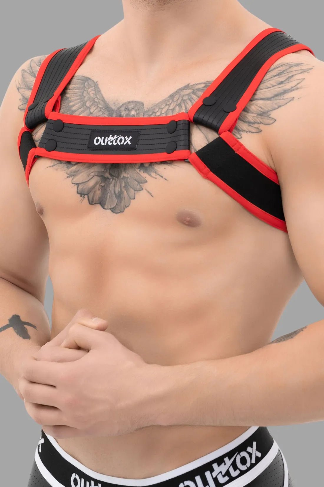 Outtox by Maskulo Bulldog Harness with Snaps in Black & Red, adjustable PU leather straps for a fetish-inspired look. Accessories.