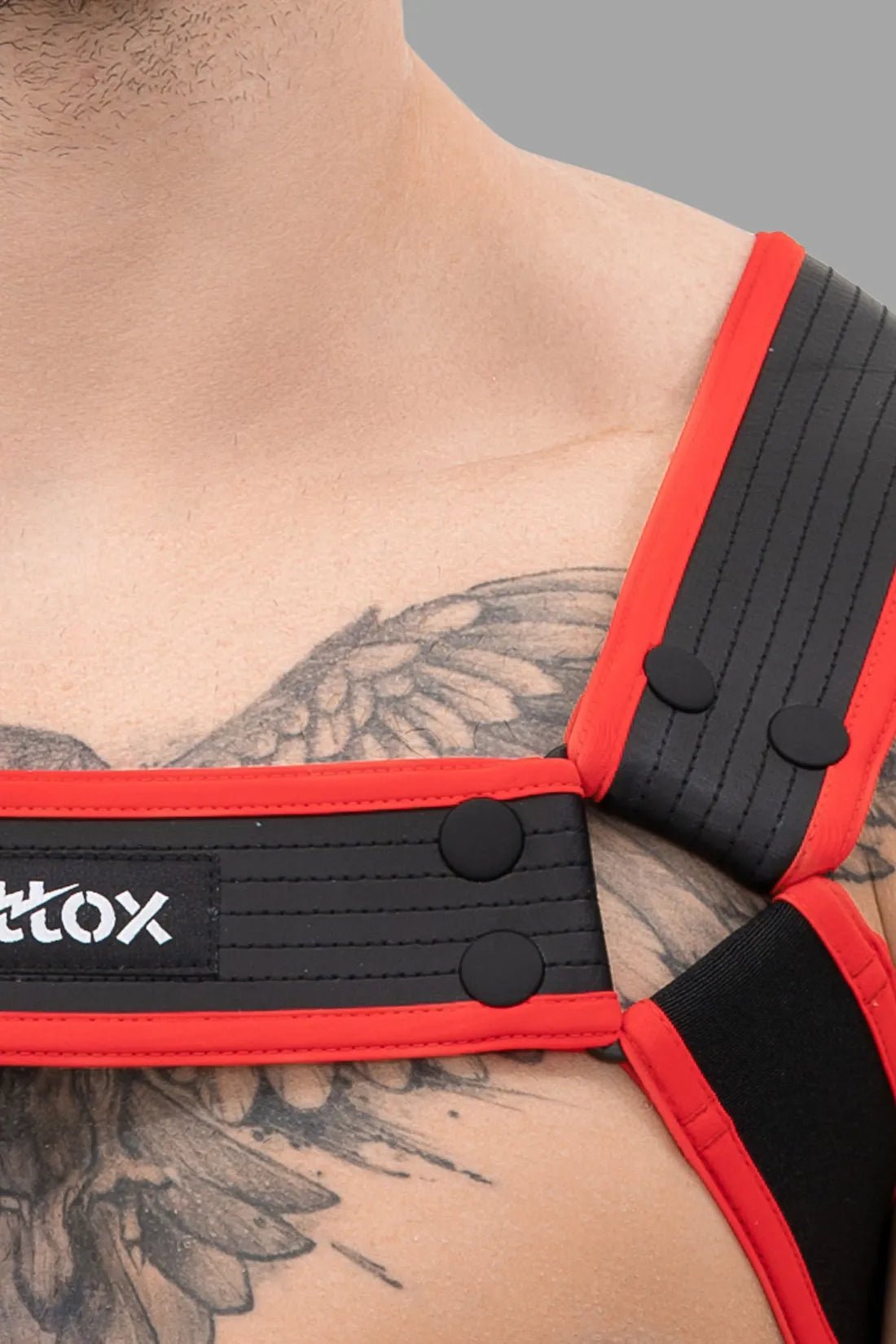 Maskulo Outtox Body Harness with Snaps in Black and Red, size XL. New condition product for male adults. Variant SKU XHR113-Y4.
