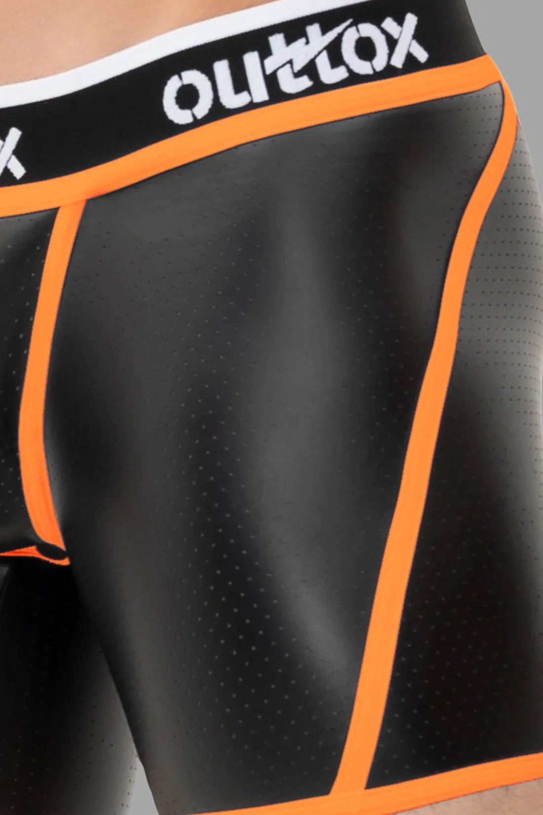Outtox Open Rear Shorts in black & neon orange: perforated PU eco leather material, snap codpiece, open rear, logo waistband. Bold style.