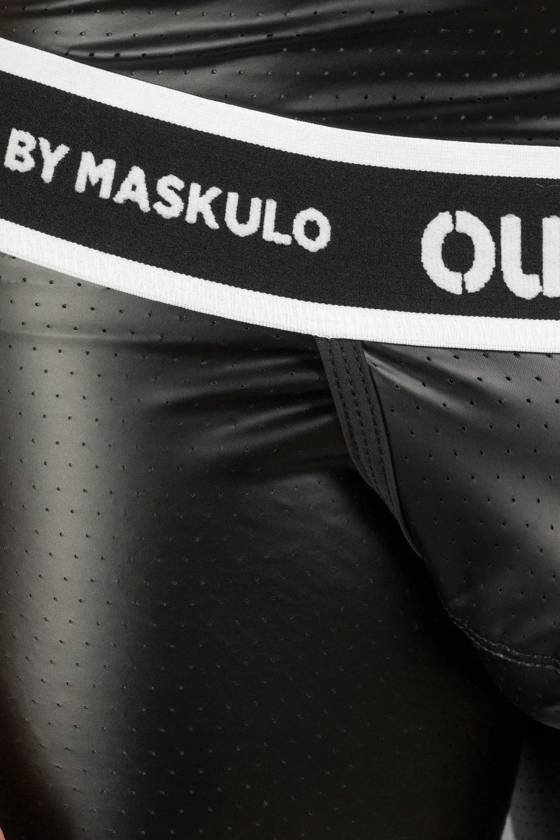 Outtox by Maskulo black shorts with snap codpiece and wrapped rear. Polyester, PU eco leather, and elastane blend for comfort and style.