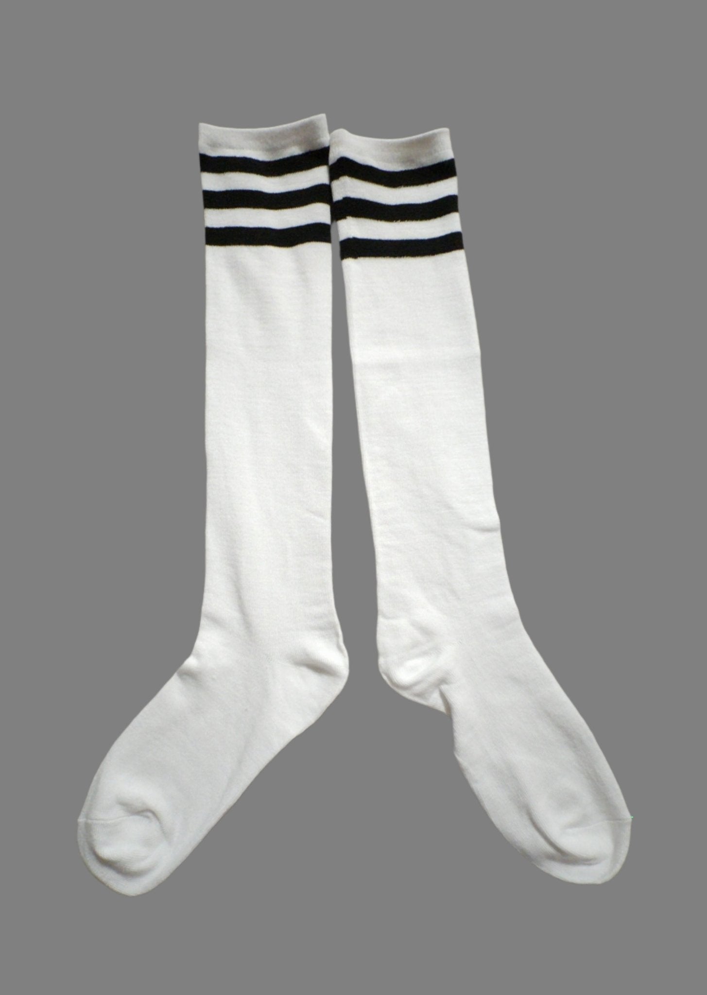Maskulo Long Socks: White with Black Stripes. Polyester and cotton blend, stretchy, 45cm total length. Ideal for football and running.