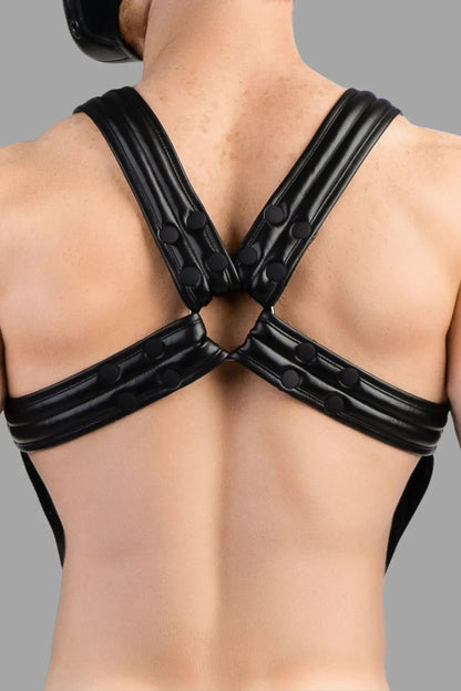 Maskulo Armored Next Body Harness in black PU leather-look. Durable polyester/polyurethane blend, bulldog style with removable cockring.