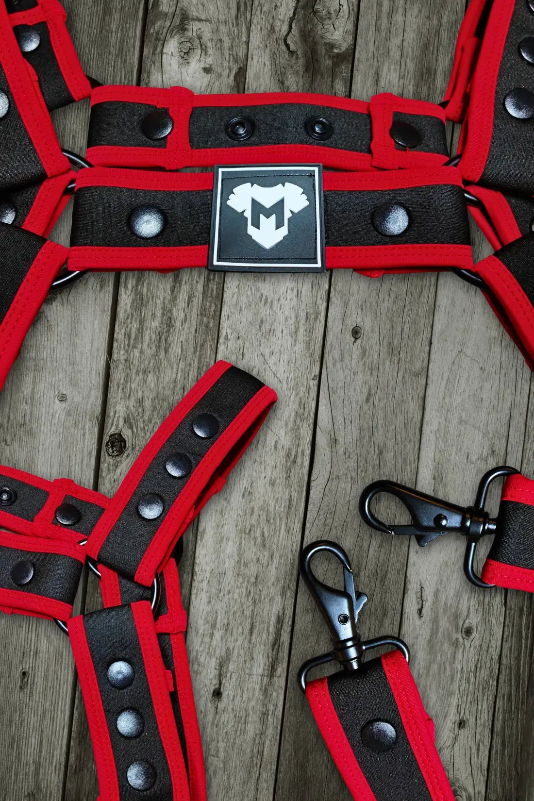 Maskulo Riven Hexguard Neoprene Body Harness in Black and Red. Stylish accessory with adjustable straps for a secure and comfortable fit.