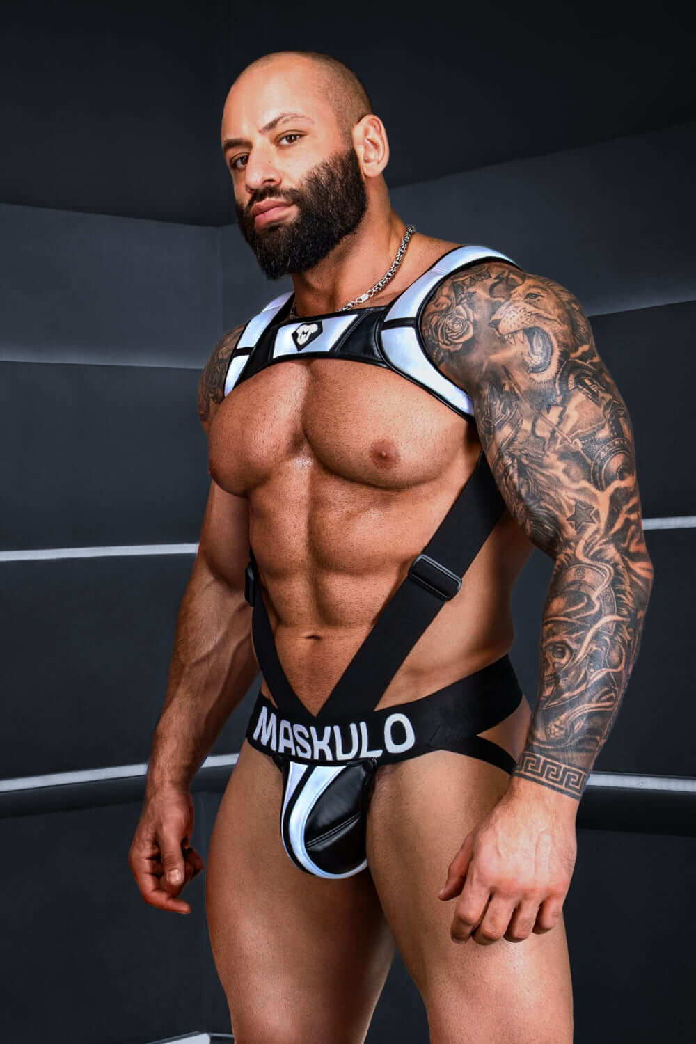 Black and grey &quot;Big Bulge&quot; jockstrap by Maskulo, featuring reflective light elements. Stylish and comfortable performance underwear for men.