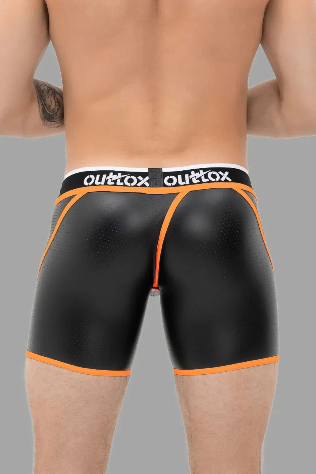 Outtox by Maskulo Wrap-Rear Short Tights with Snap Codpiece in Black and Orange. Tight-fit, perforated shorts for daring wear.