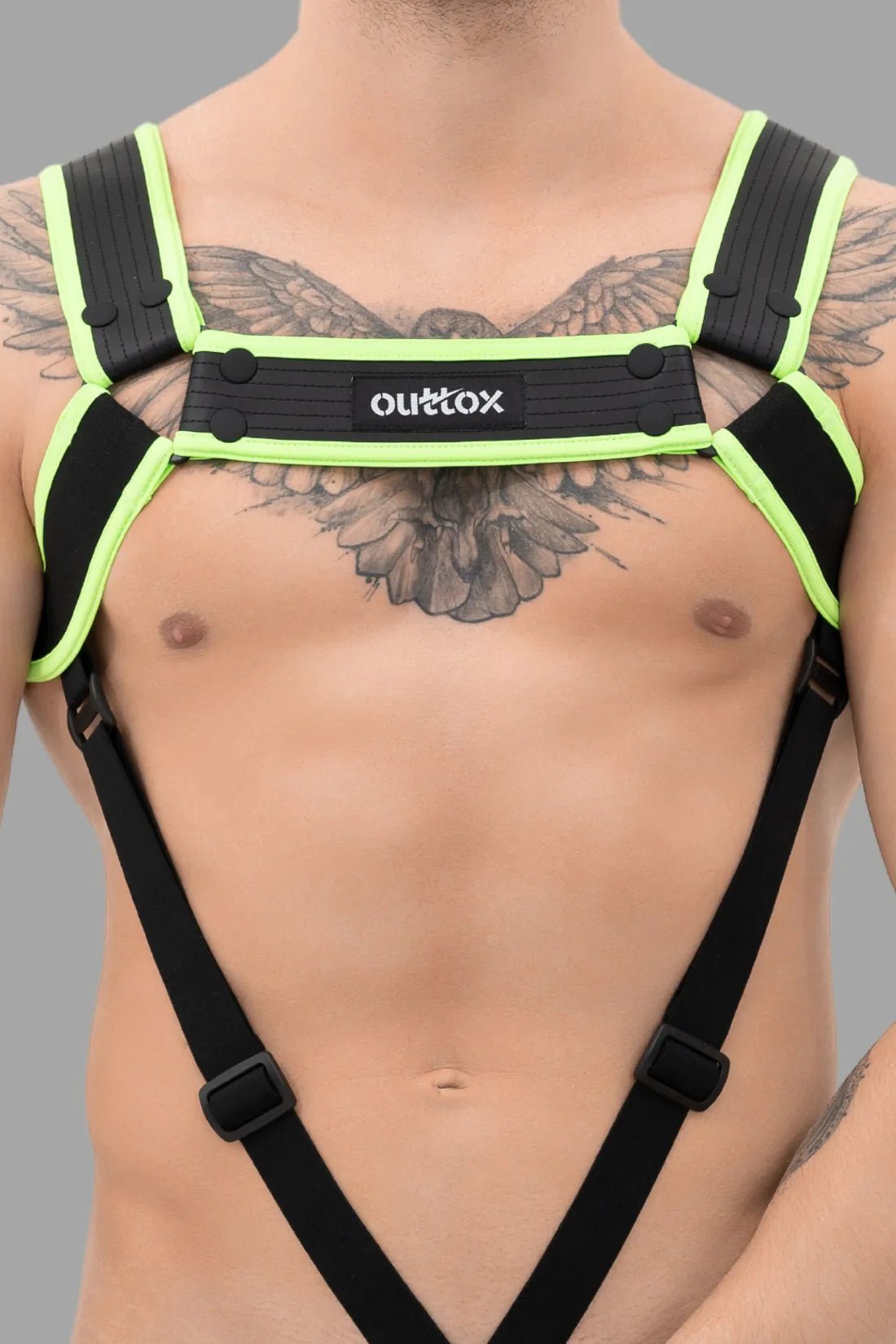 Outtox Body Harness with Snaps in Black and Neon Green from Maskulo, polyester-blend with integrated cockring for comfortable fit.