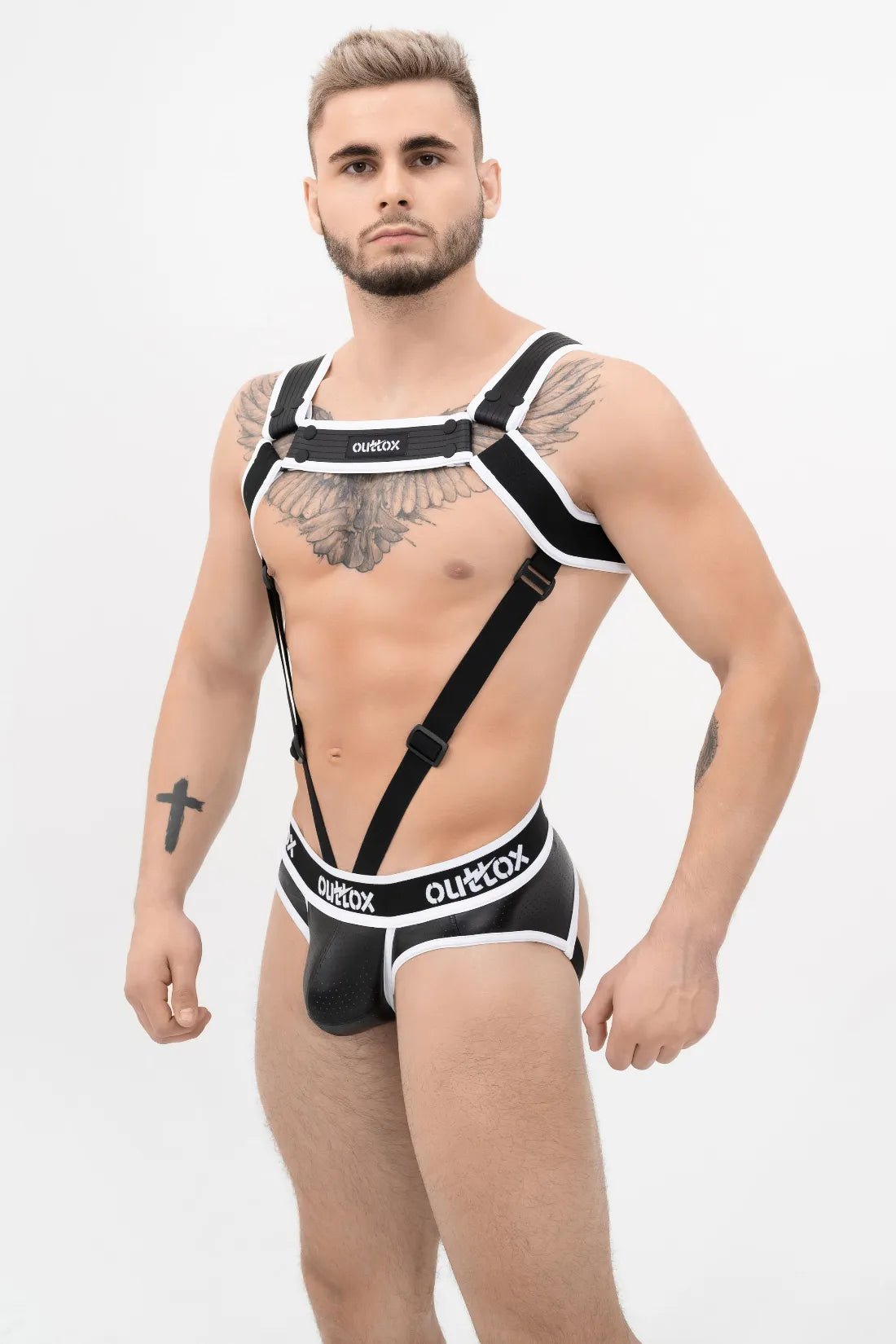 Outtox Black &amp; White Body Harness with Snaps. Polyester/Polyurethane/Elastane blend, features easy-to-attach snaps &amp; cockring for Push-up Effect.