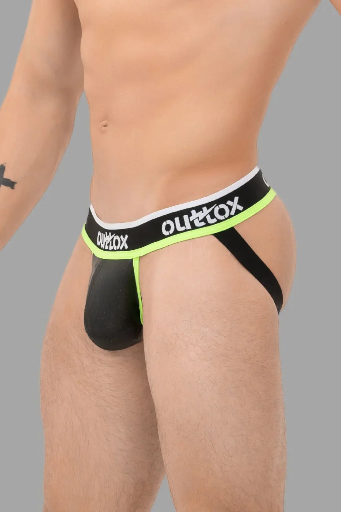 Outtox Black Green Neon Jock with Snap Codpiece. Polyester, PU eco leather, elastane blend. Comfortable, breathable underwear.